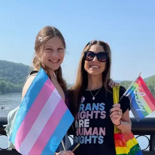 A trans teen and her mother sporting trans pride gear